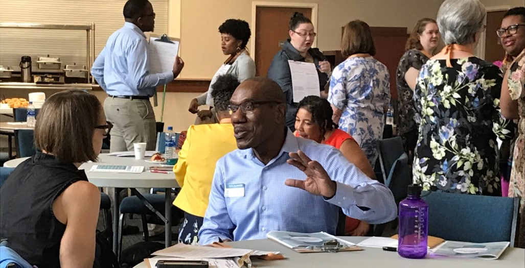 African American man conversing with a White woman